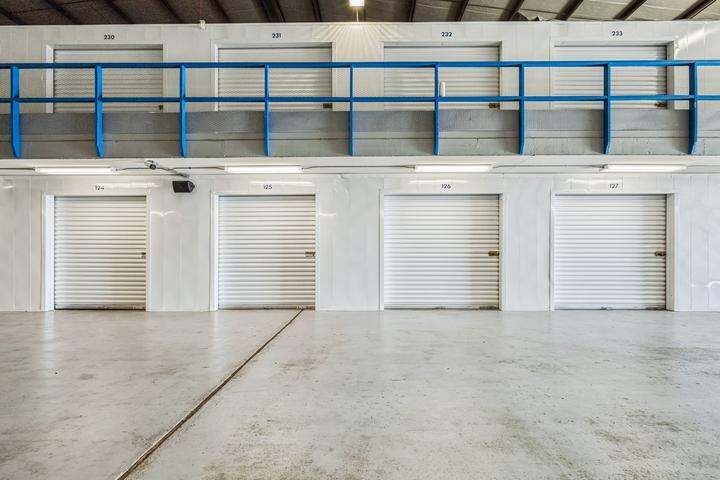 rows of self storage units at StorageMart on Silver Spring Dr