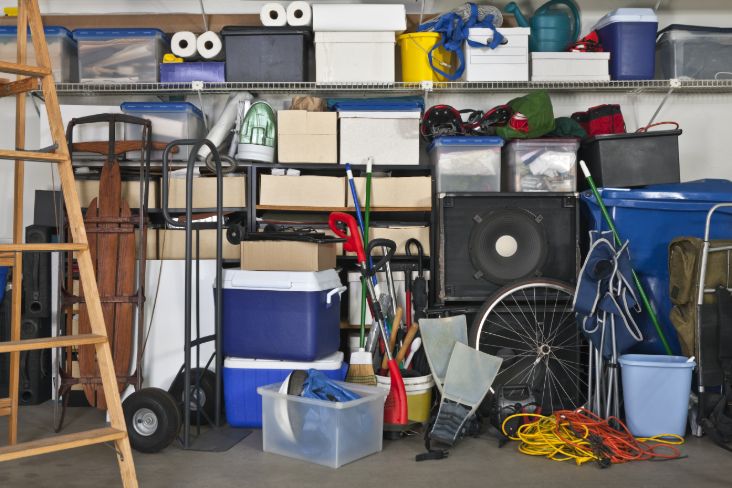 Garage bursting at the seams with piled up clutter