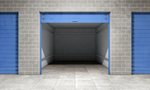An open self storage unit with a blue door
