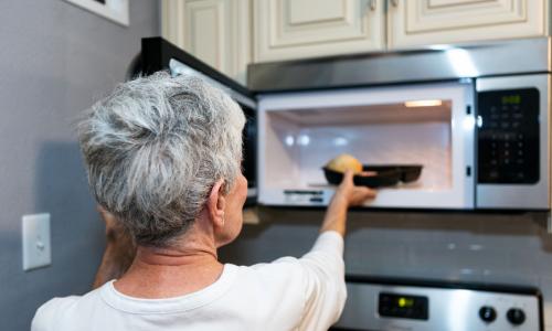 Women at a microwave