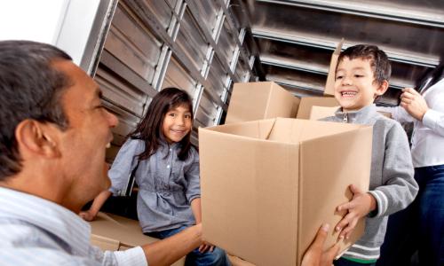 Family packing a moving truck