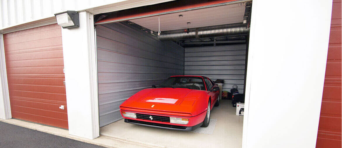 indoor parking storage a red sports car parked in indoor parking storage