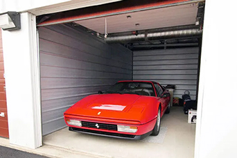 Red Car parked in a Self Storage Unit